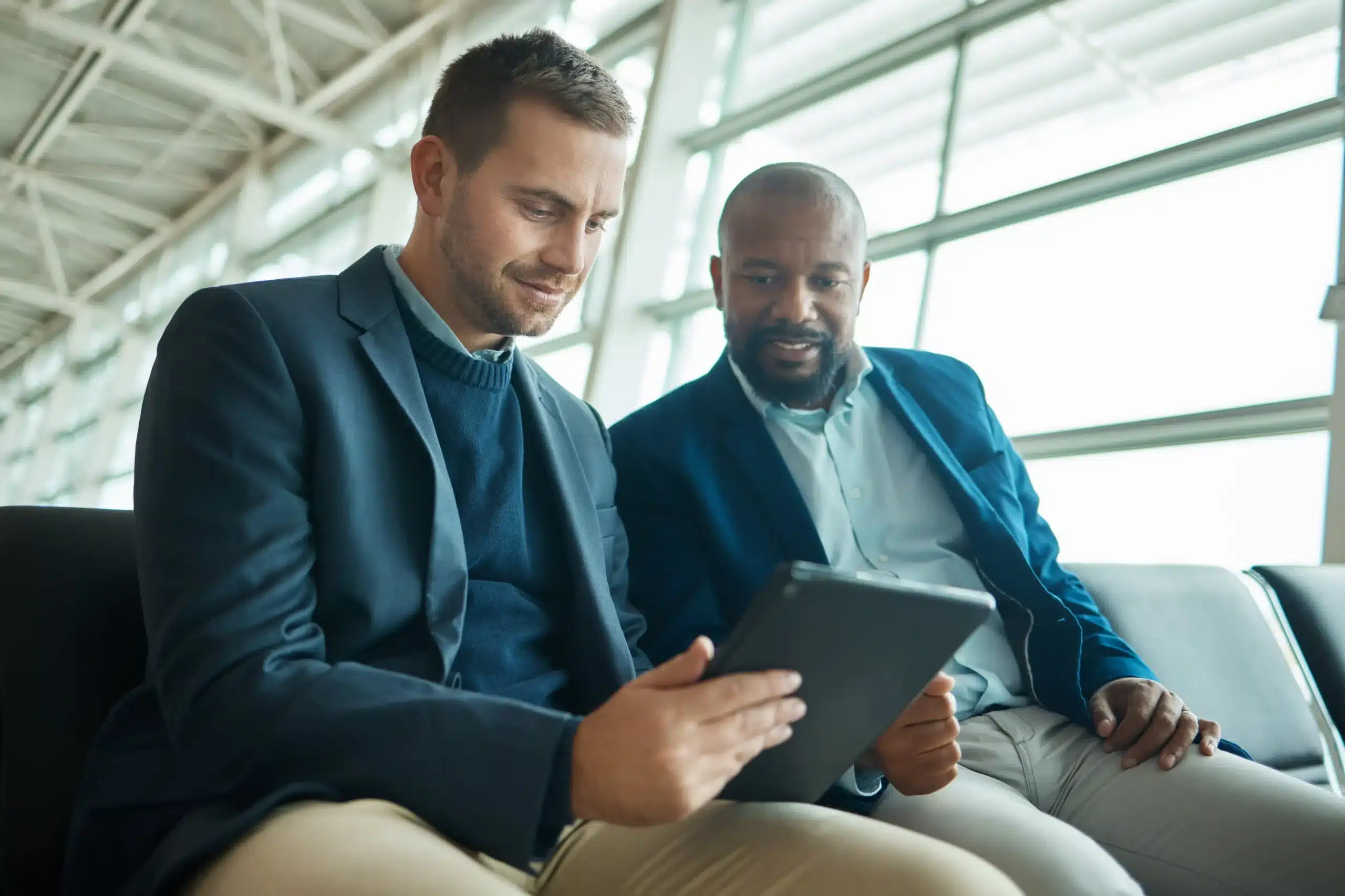 men looking at a tablet